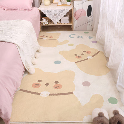 Cute animal face area rug in beige and cream with small green and blue details.