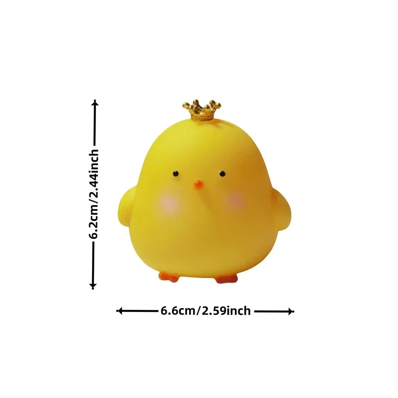 Yellow silicone chick LED night light with small crown on top; measurements shown