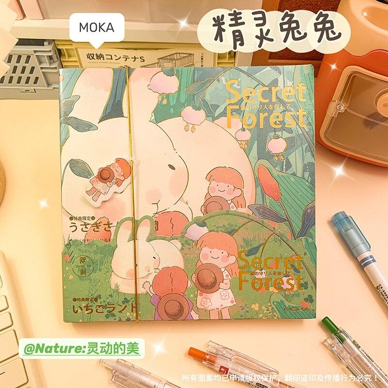 Green and pink illustrated notebook cover with characters and 'Secret Forest' text