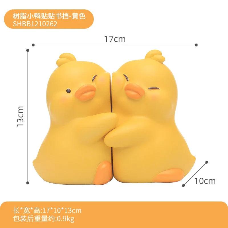 Yellow duck book end set of two, shown with size outline and dimension marks