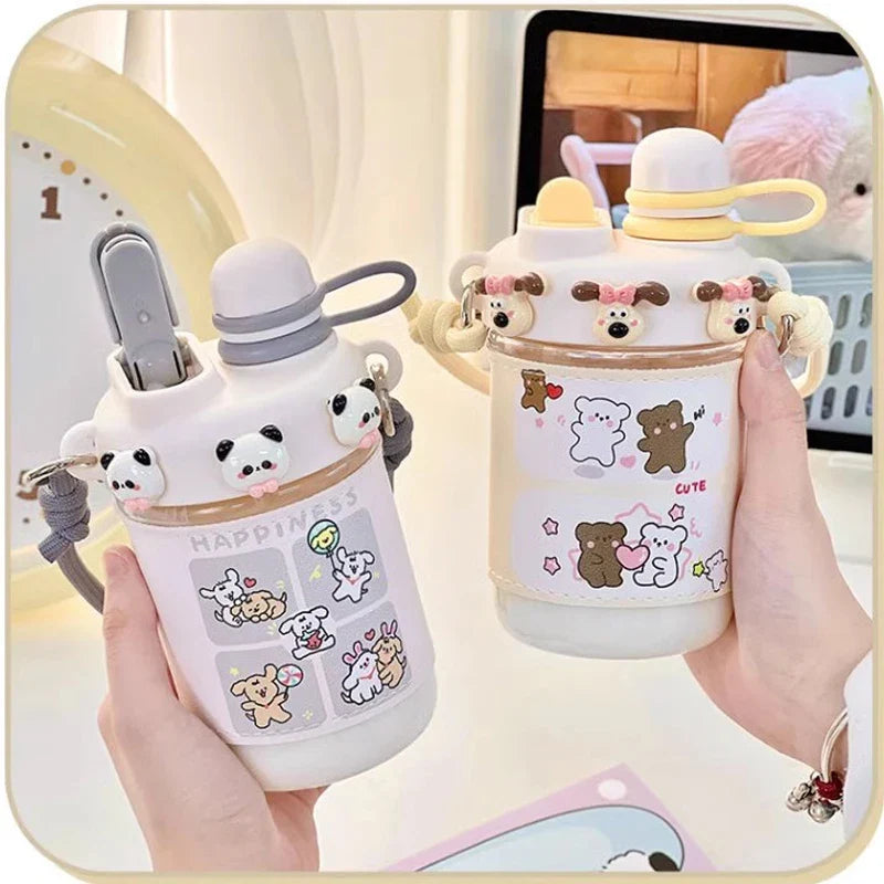 White kids water bottle with straw lid and gray carry strap, cute panda animal stickers