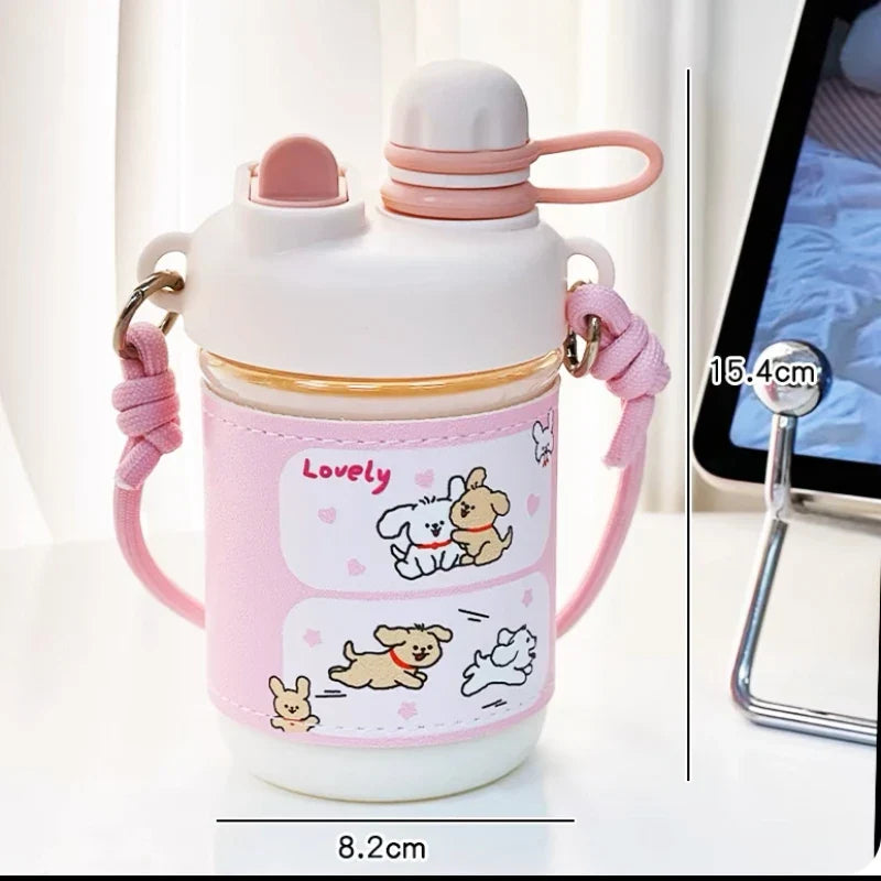 Pink kids water bottle with straw lid and carry strap, cute dog and rabbit cartoon art