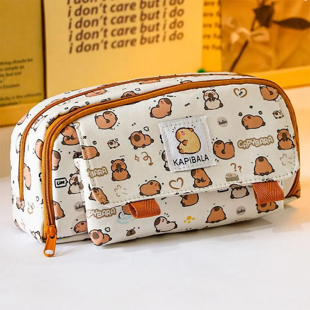Capybara print pencil bag with front patch pocket and orange handle pull tab