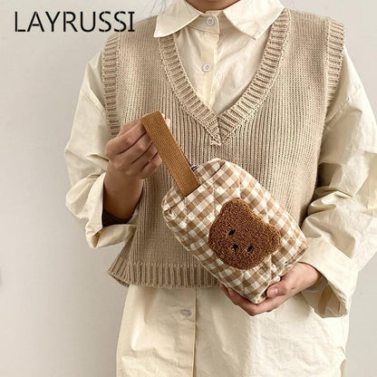 Gingham teddy bear cosmetics bag held with detachable shoulder strap