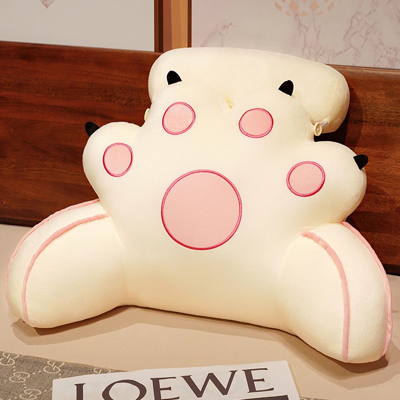 White cat-paw reading pillow with black ear tips and pink outlined face circles