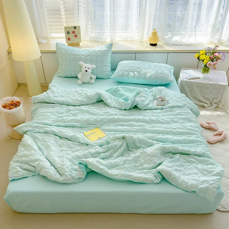 Mint green seersucker duvet cover set with matching pillow shams and crinkle texture