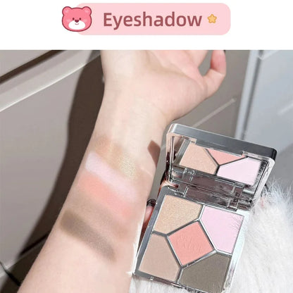 Four-pan eyeshadow palette compact with nude, pink, and light tan shades