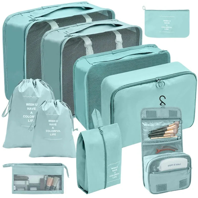 Mint teal packing cubes set with mesh panels and zippered compartments for travel storage.