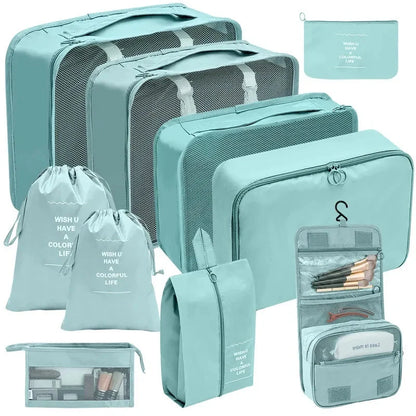 Mint teal packing cubes set with mesh panels and zippered compartments for travel storage.