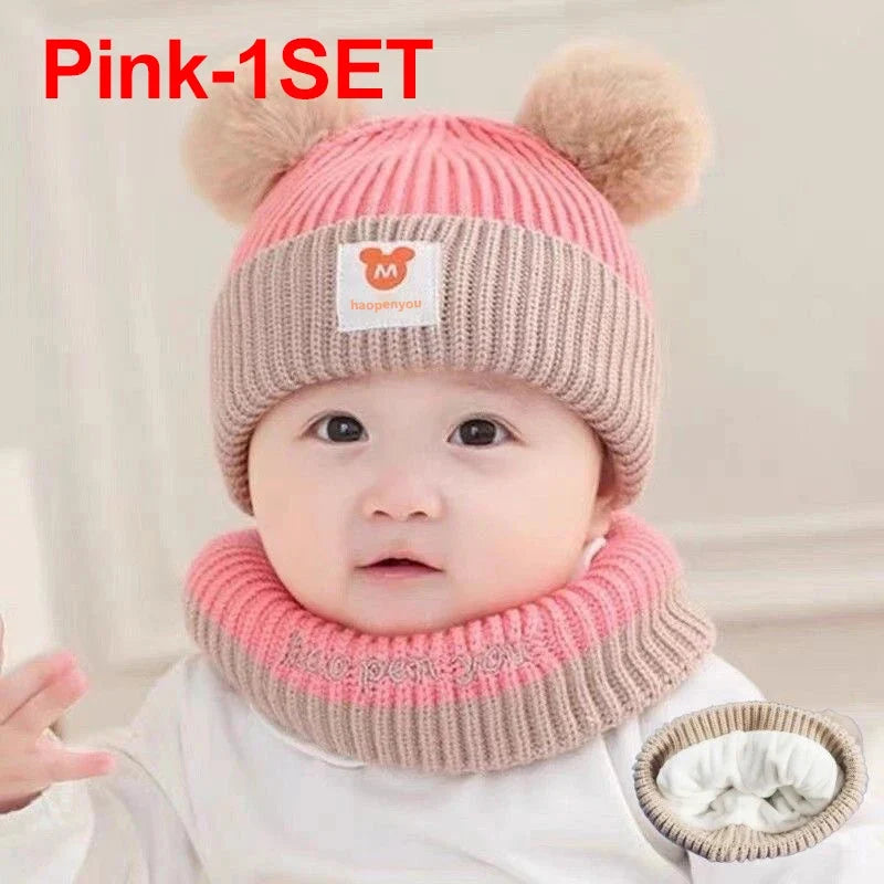 Pink knit kids beanie hat with pom-poms and matching neck warmer