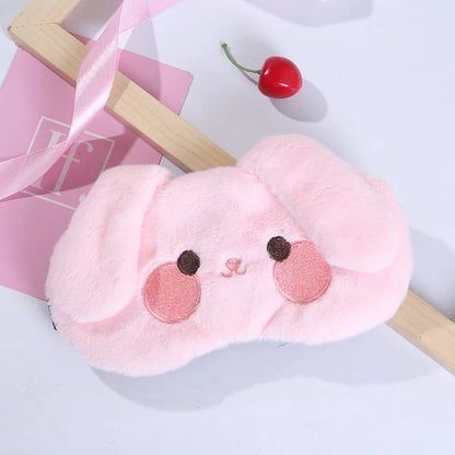 Pink bunny plush sleep mask with soft fur and stitched smile, ears, and rosy cheeks