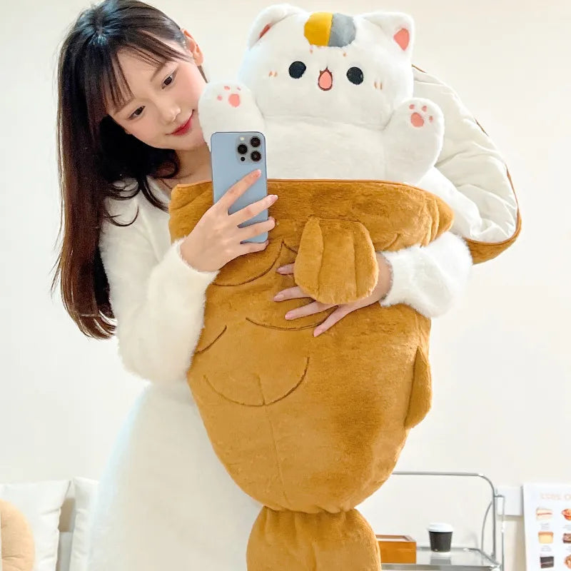 White and brown plush animal with cat face ears and long plush tail, held by child