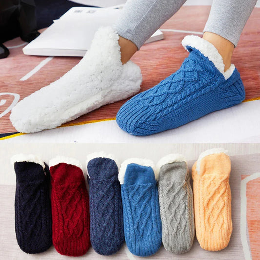 Fuzzy thermal slipper socks in navy blue with cable knit pattern and sherpa cuff