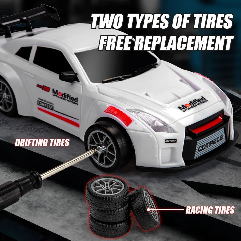 White RC drift racing car with sporty body kit and two sets of tires, 1:24 scale toy