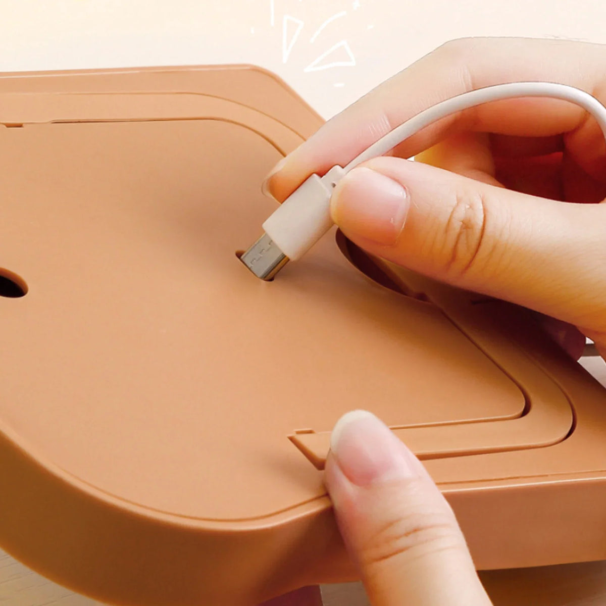 Toast-shaped LED makeup mirror, showing USB power cable connection port on base