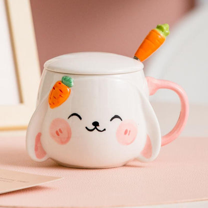 Rabbit ceramic mug with lid and carrot spoon, pink handle, smiling bunny face.