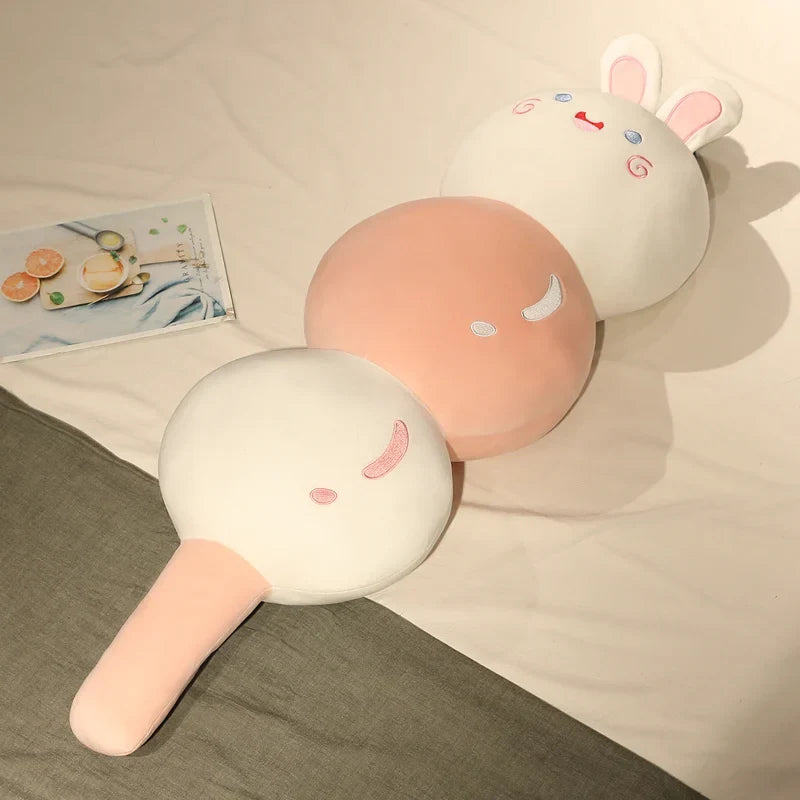 Animal dango snack plush trio with bunny ears and pig faces, cream and peach