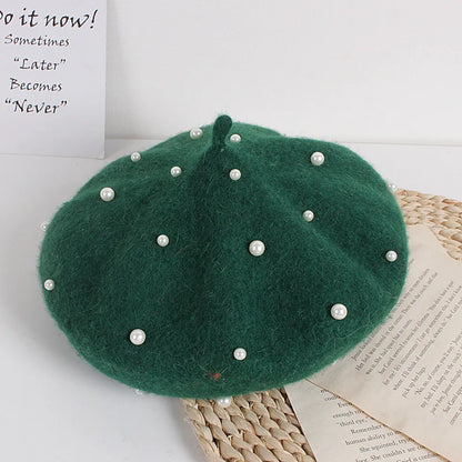 Green felt beret with faux pearl embellishments and pointed crown