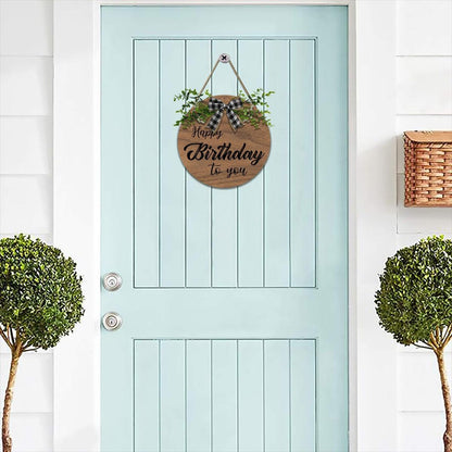 Happy Birthday wooden door sign with plaid bow, green foliage, hanging rope loop