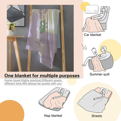 Printed flannel blanket draped over furniture with dragon graphic and “MORGAN” band