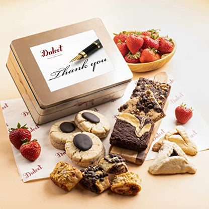 Brownie and cookie gift tin with assorted pastries and strawberries