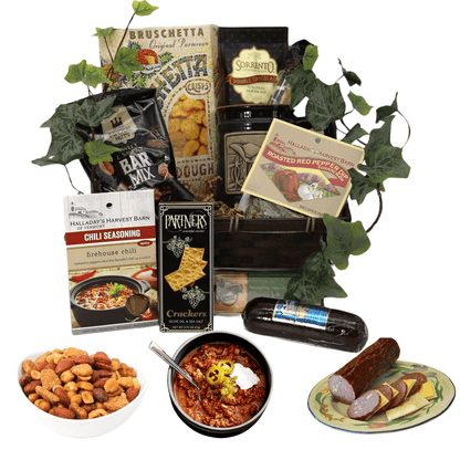 Gift basket with assorted snacks, crackers, nuts, and a bottle with mini plates