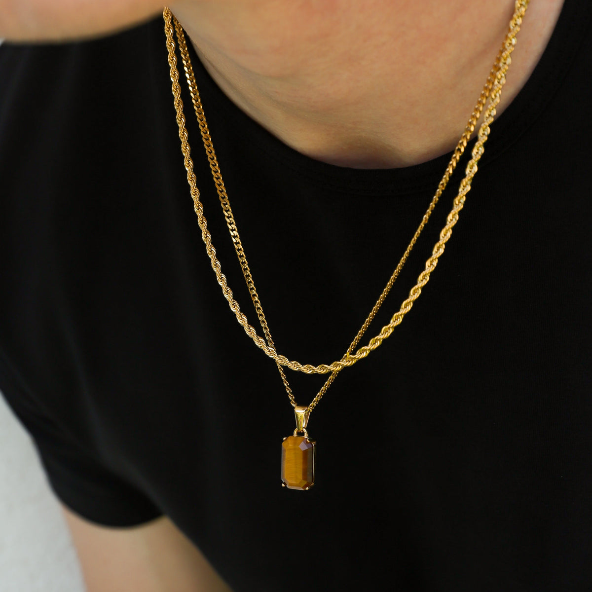 Gold tiger eye pendant necklace set with layered rope chains and rectangular stone charm