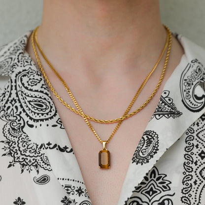 Gold tiger eye pendant necklace set with two layered chains and rectangular stone charm