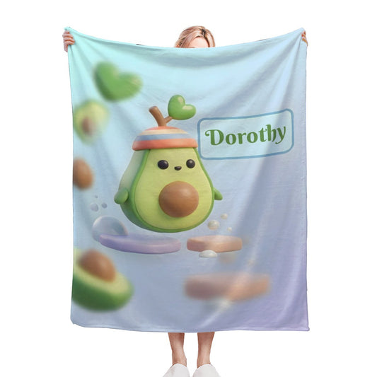 Light blue avocado cartoon blanket with Dorothy text and character face