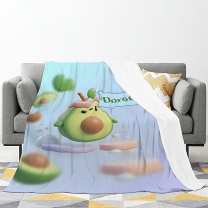 Light blue avocado cartoon blanket draped over couch with visible white edge