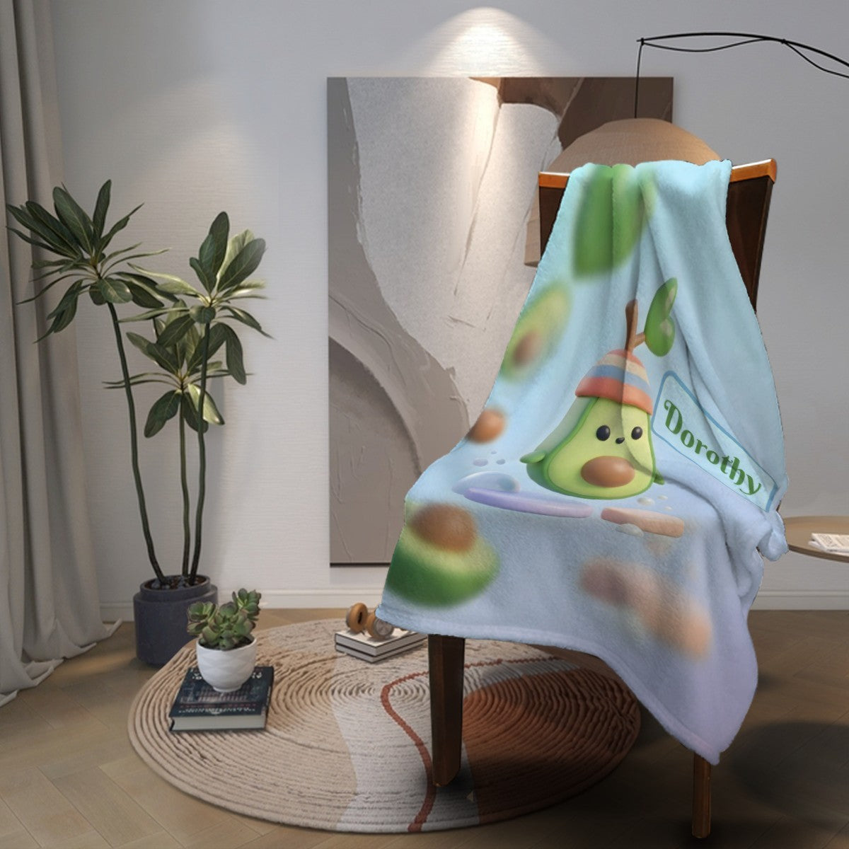 Light blue avocado cartoon blanket with Dorothy logo, draped over chair back