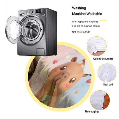Capybara character blanket on bed with Amanda label, soft flannel texture