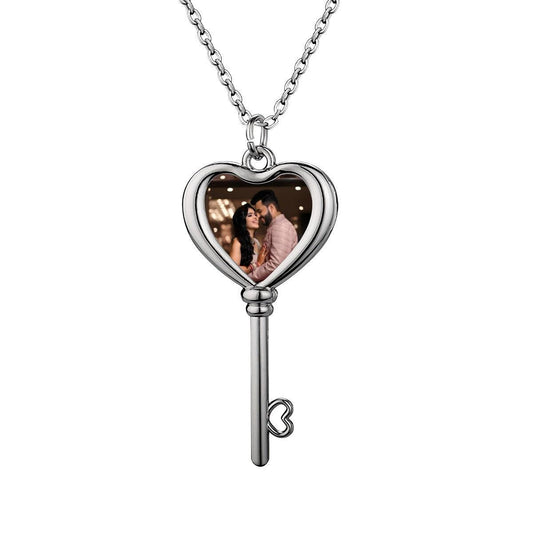 Heart-shaped key pendant photo necklace with heart locket and dangling key, silver-tone