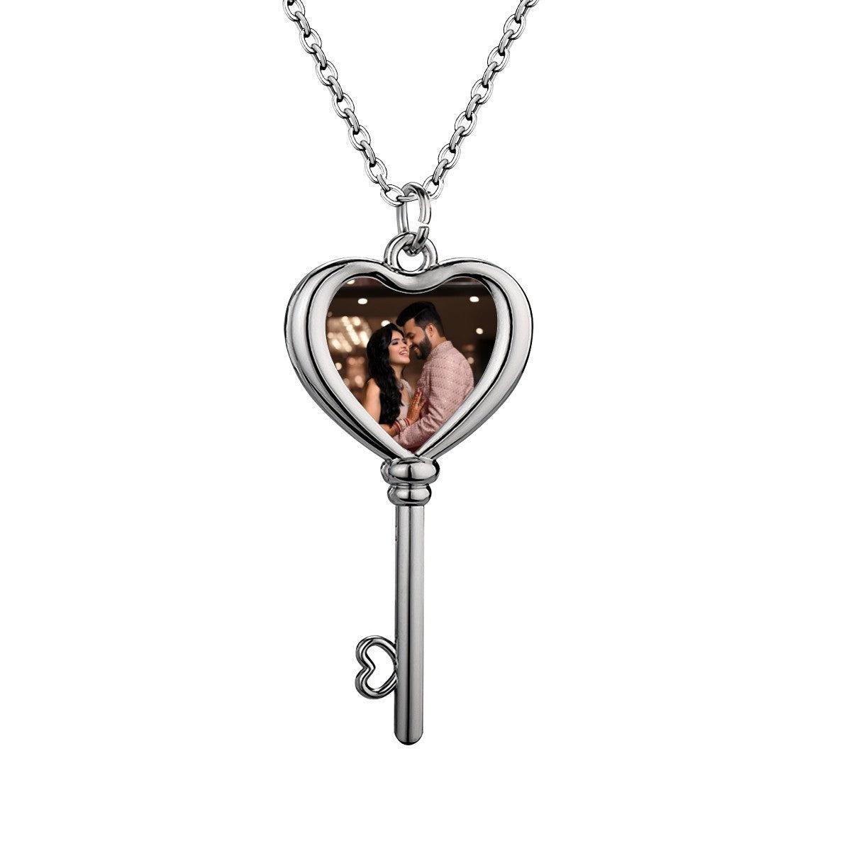 Silver-tone heart locket and key pendant photo necklace with chain, heart window showing couple