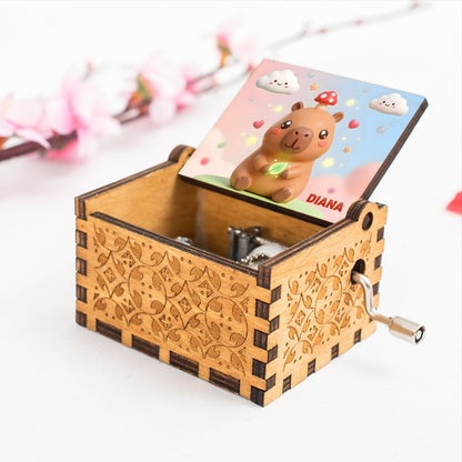 Wooden music box with capybara character lid and 'DIANA' label