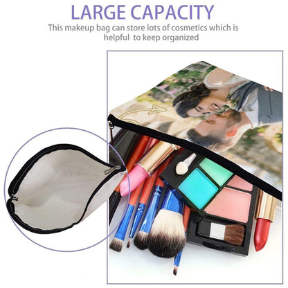 Open white makeup pouch with black zipper, showing cosmetics and brushes inside