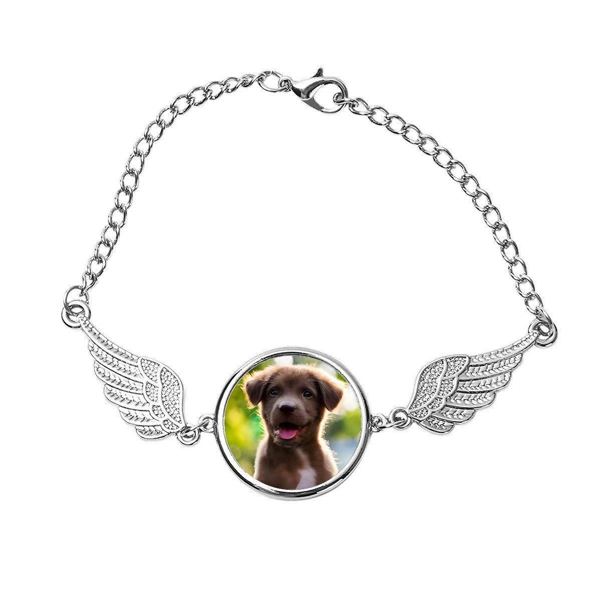 Silver pet memorial photo bracelet with round dog photo locket and angel wing charms