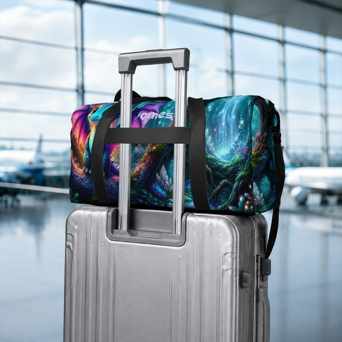 Duffel bag with colorful dragon space print strapped to rolling suitcase