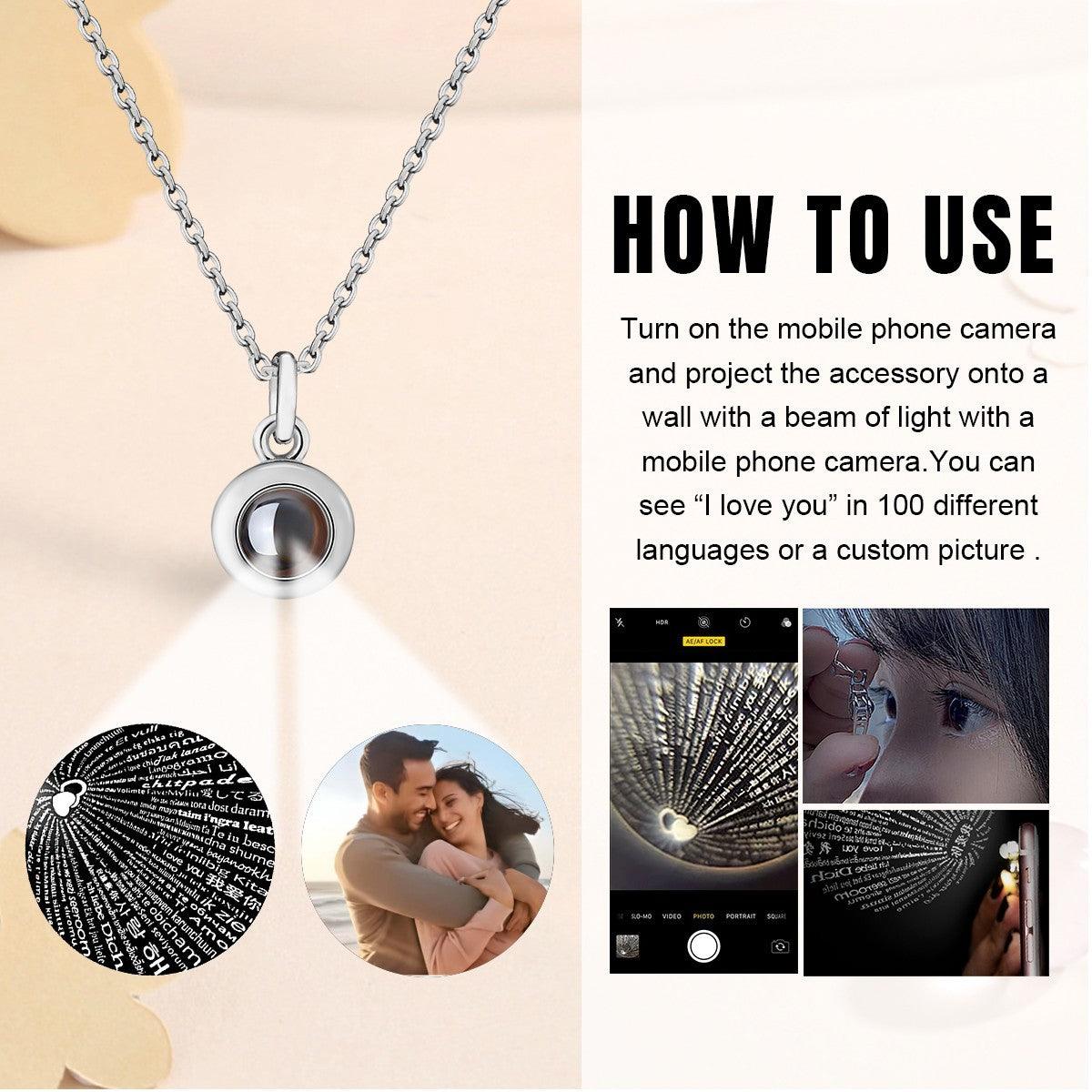 Silver photo projection necklace with round locket pendant and circular projection lens