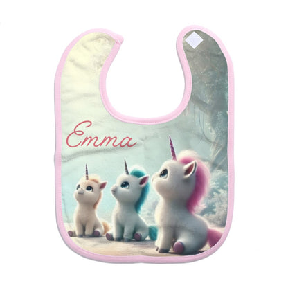 Personalized baby bib with three unicorns and “Emma” on mint fabric, pink trim.