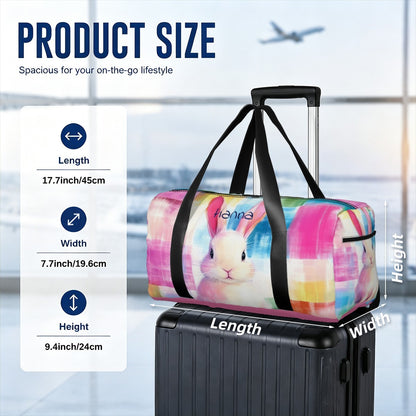 Colorful rabbit print duffel bag on suitcase with black straps and top handles