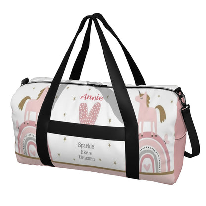 White and pink unicorn duffel bag with black zip top and side strap