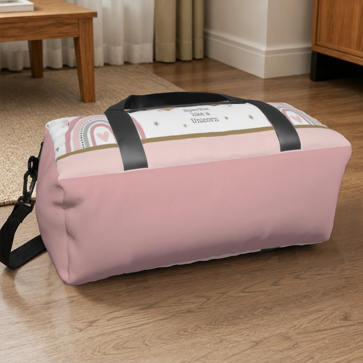 Pink and white unicorn duffel bag with black handles and zip closure