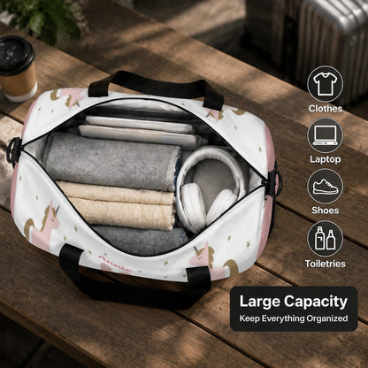 Unicorn duffel bag open with rolled clothes and headphones inside