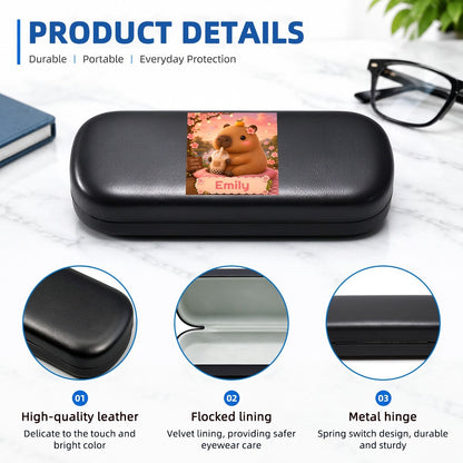 Black hard eyeglasses case with capybara photo insert, front view and details callouts.
