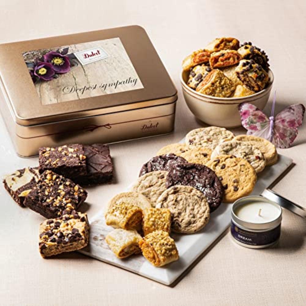 Gift tin with assorted treats: cookies, brownies, and a small candle