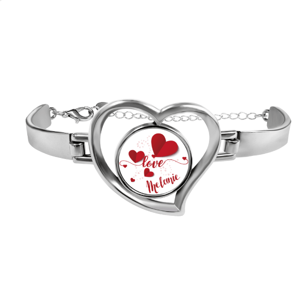 Silver-tone heart locket bracelet with red hearts and cursive name inside