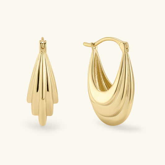 Gold abstract hoop earrings with textured teardrop fronts