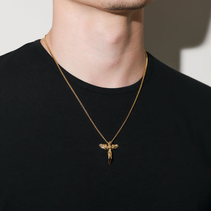 Gold rope chain necklace with guardian angel pendant, angled view on neck