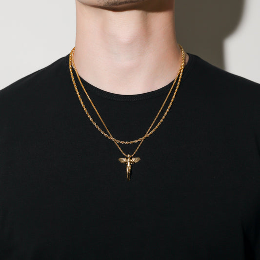 Gold rope chain necklace with guardian angel pendant, layered on a short chain